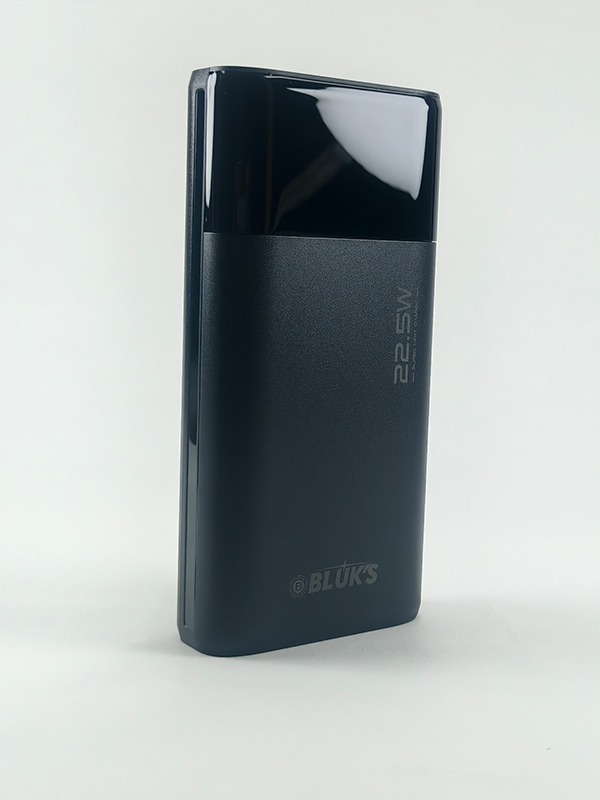 Black BX-305 20000mAh power bank showing digital LED display and multiple charging ports.